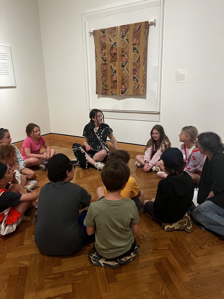 students sit in circle