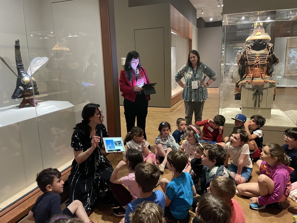 docent talks to students