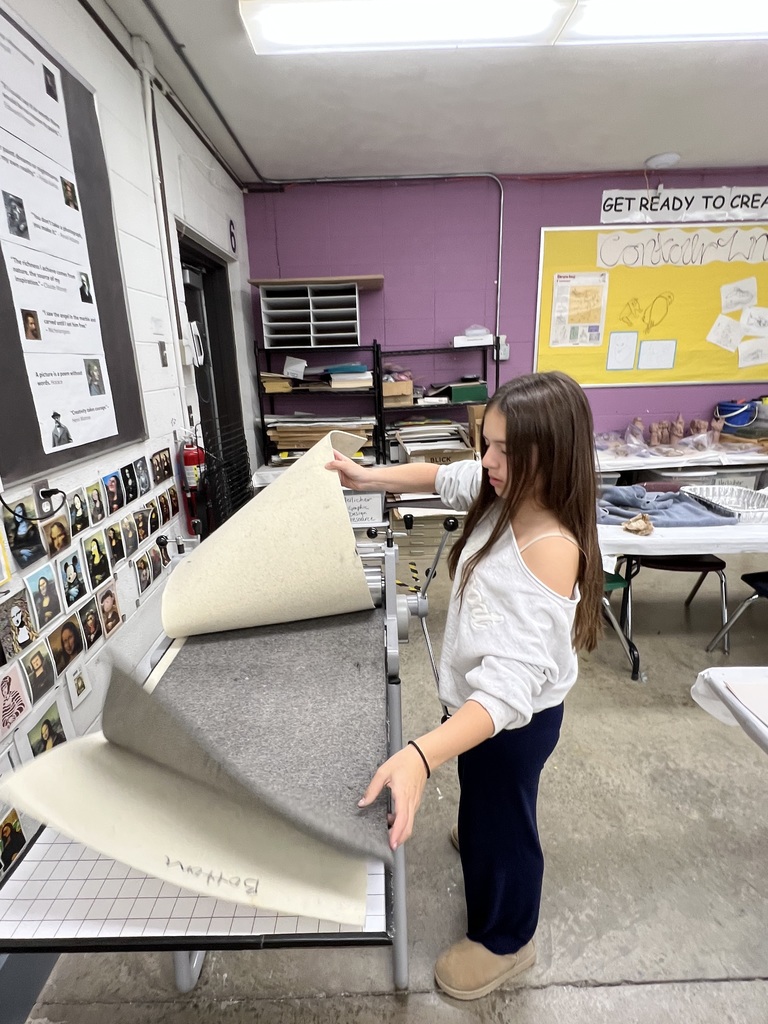 student uses printing press