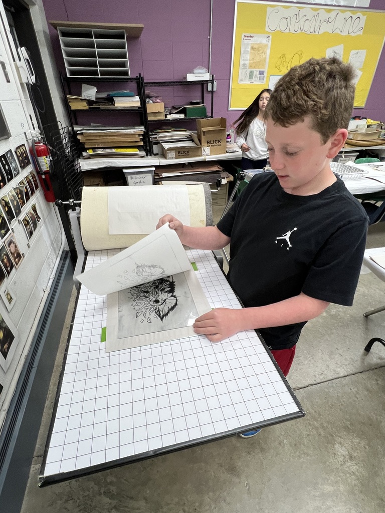 student uses printing press