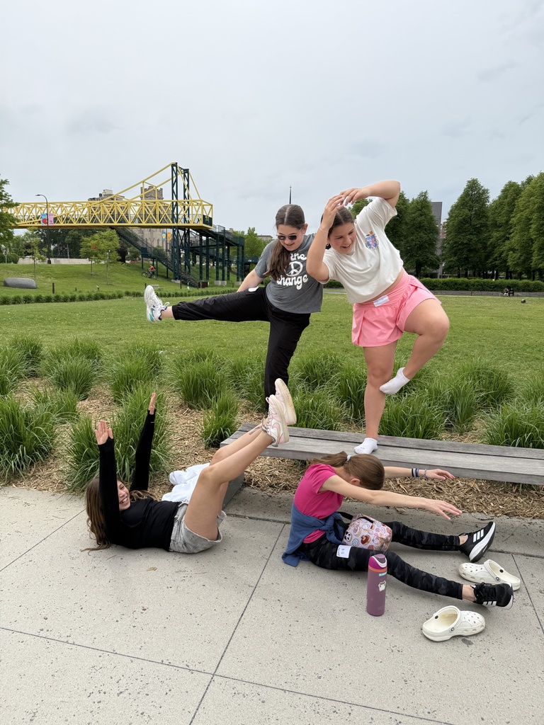 girls pose as sculpture