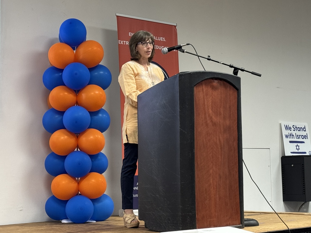 Board Chair Esther Goldberg-Davis speaks