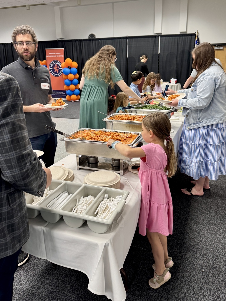 families go through buffet line