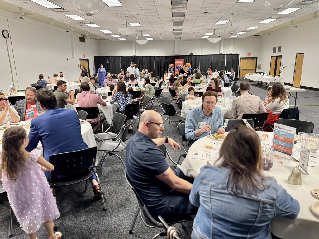tables of families eating and talking