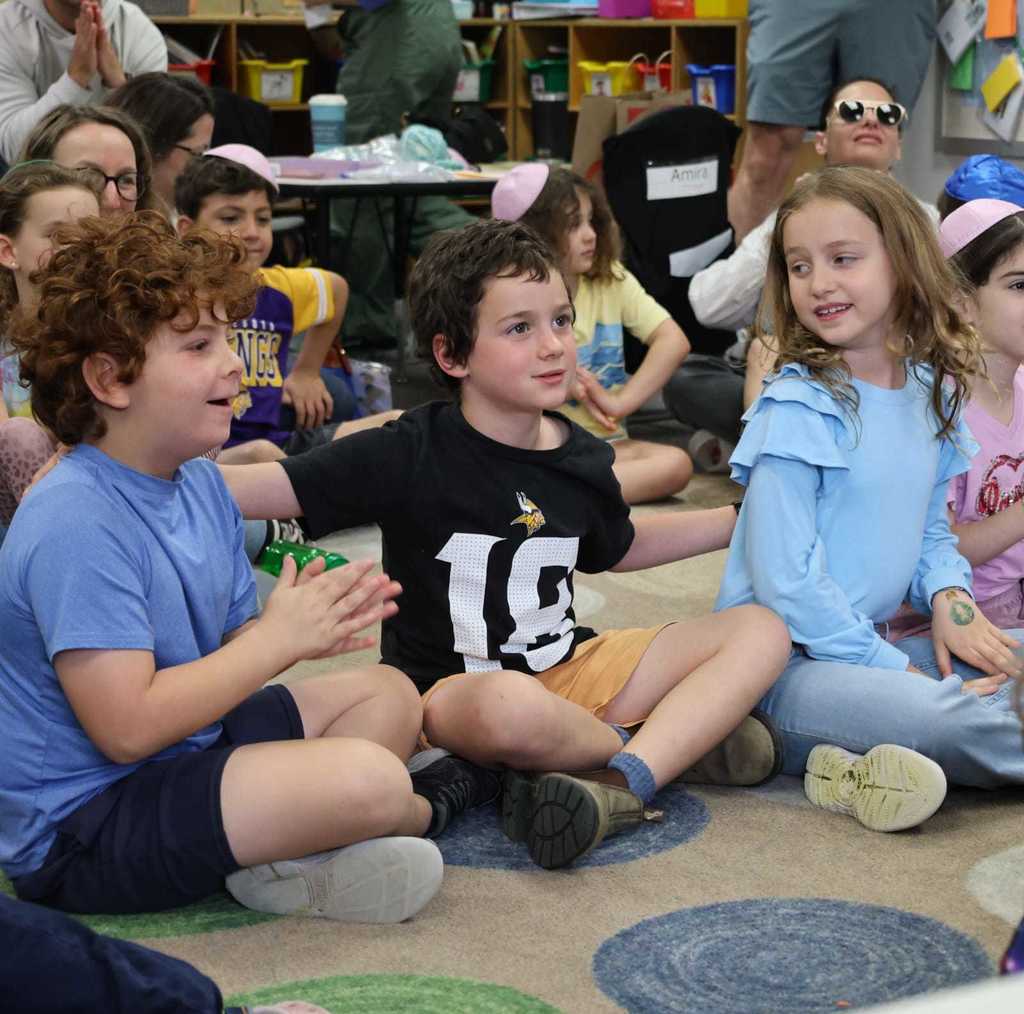 students with arms around one another