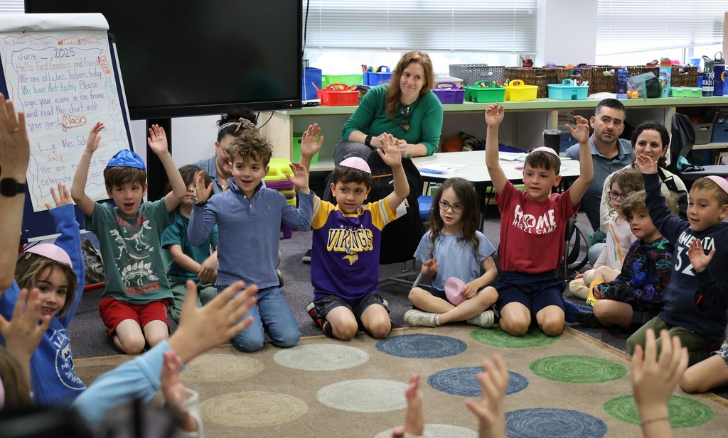 students raise arms