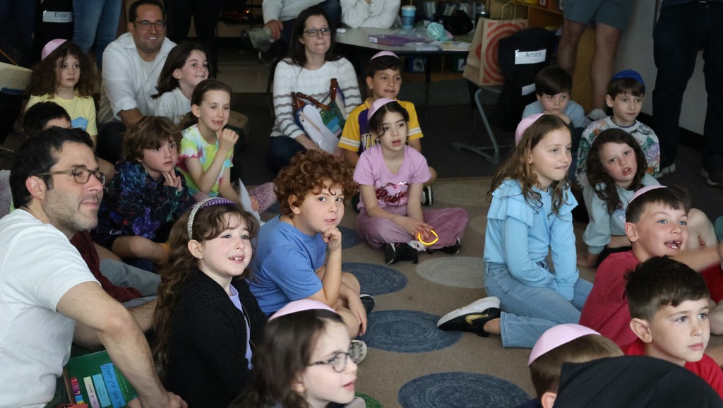 students and parents watch slideshow