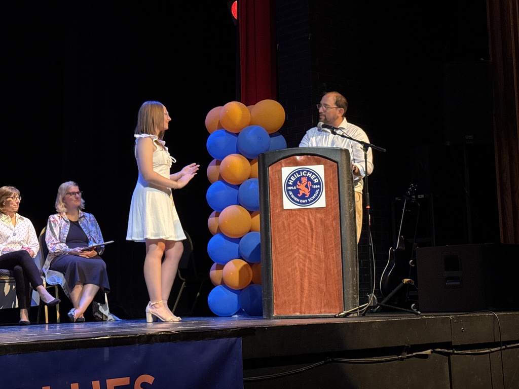 teacher speaks to eighth grader