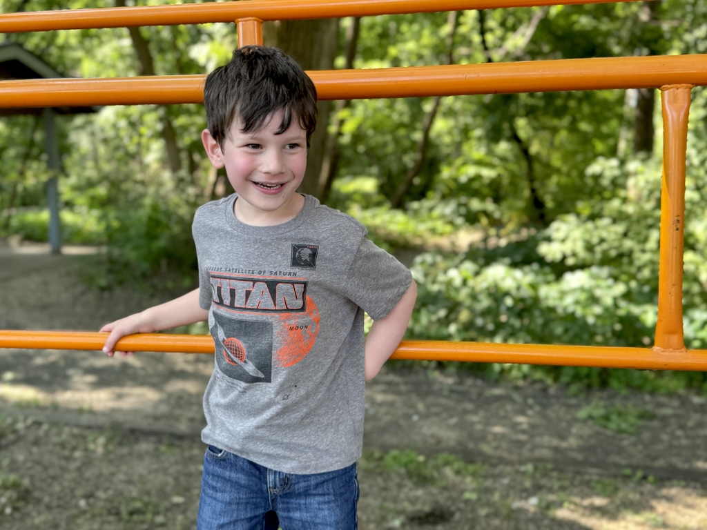 kid smiling on playground
