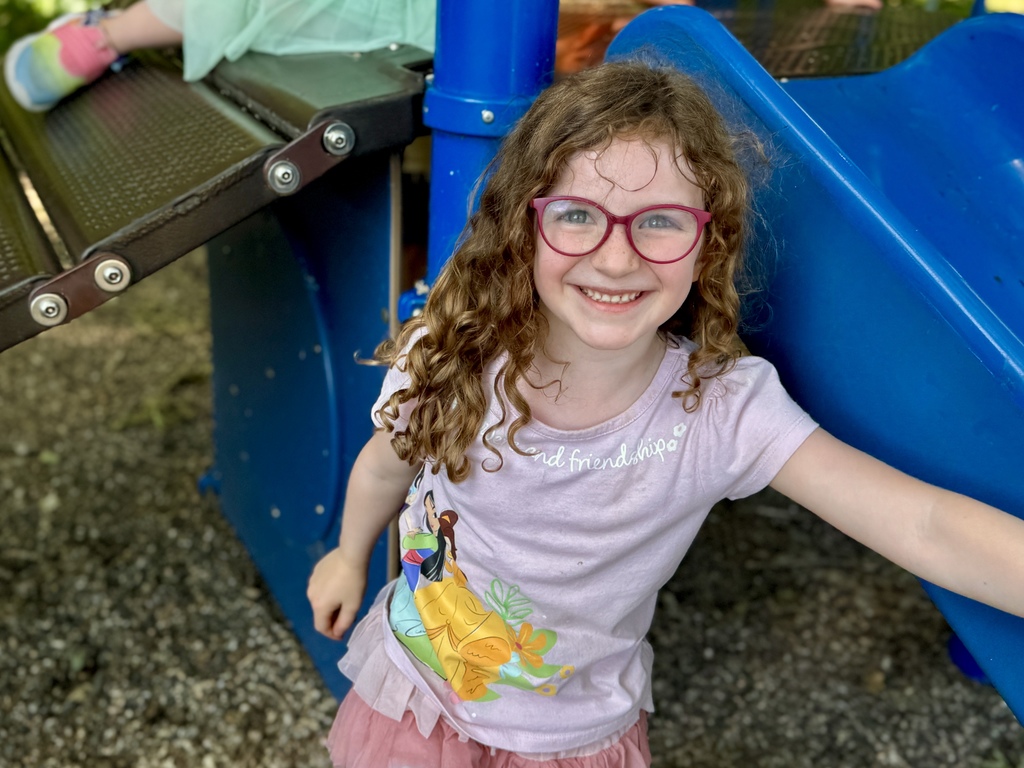 kid smiling on playground