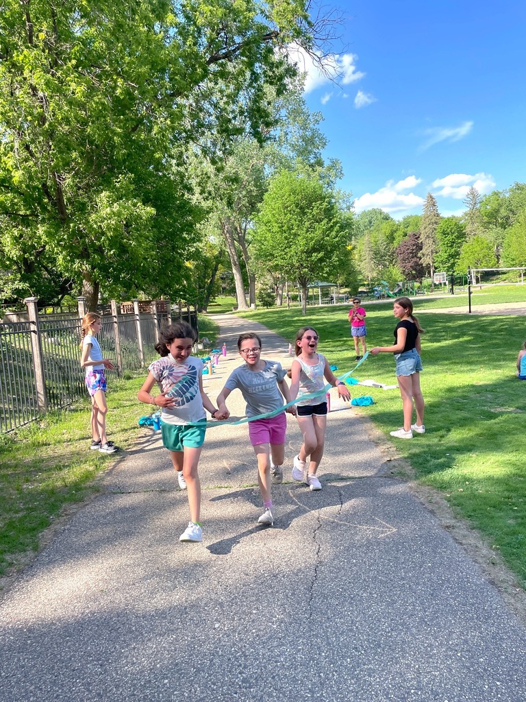 Girls on the Run runner cross finish line