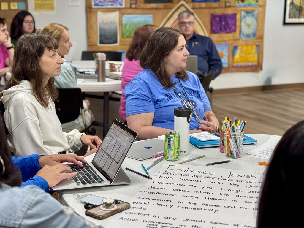 teachers listen to presentation