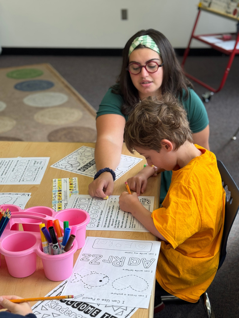 teacher helps student
