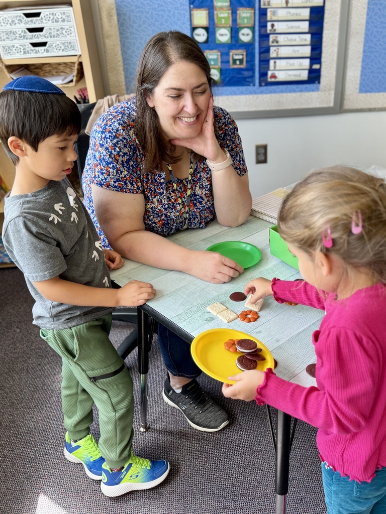 students do activity with teacher