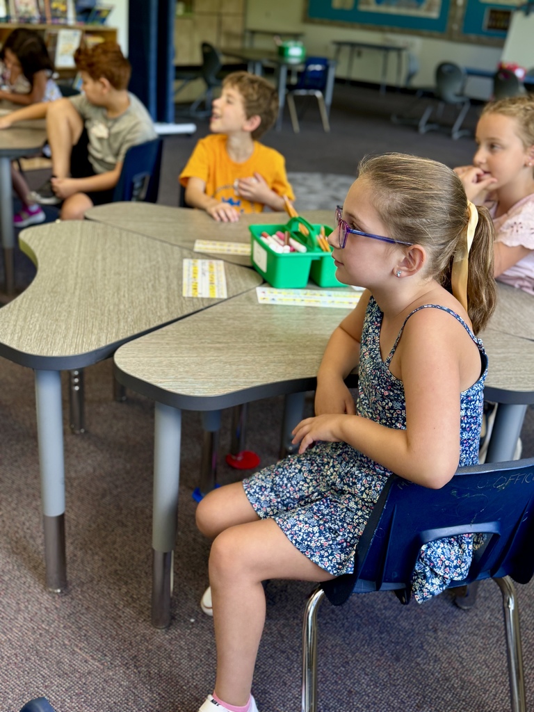 students listen to teacher