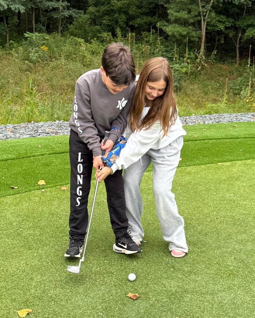 students play "three-armed" golf