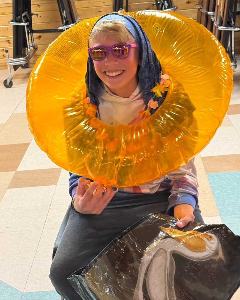 student with beach items for relay race