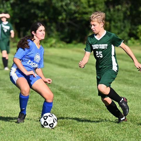 Smith player versus soccer opponent