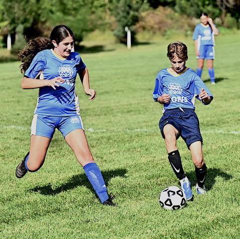 Smith player dribbles soccer ball