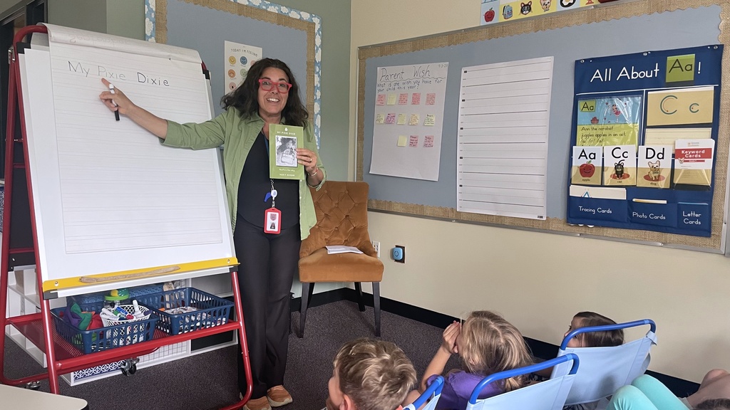 Ms. Schear shows book title, My Pixie Dixie