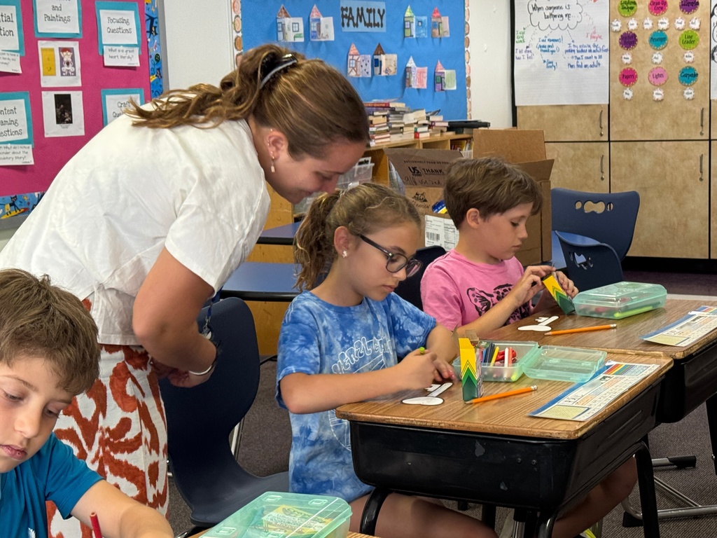 fourth graders write resolutions on keys with bat sherut
