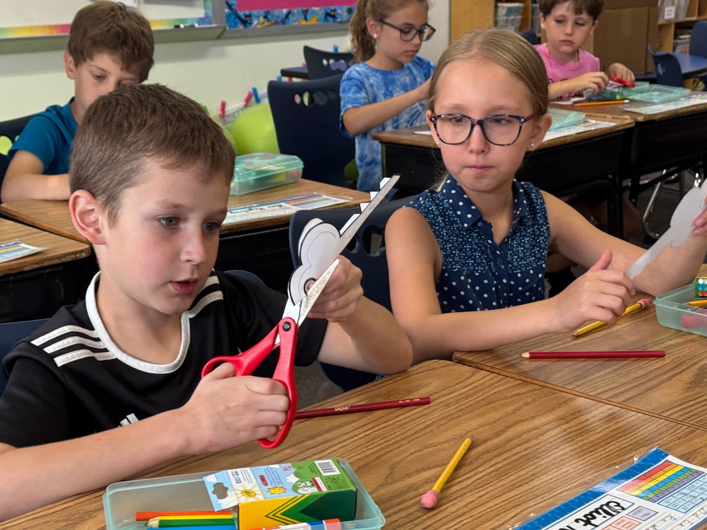 fourth graders cuts out key