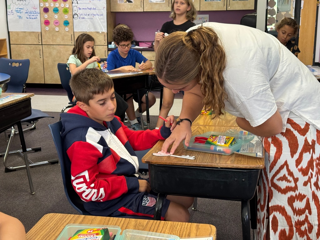 fourth grader writes resolution on key with bat sherut