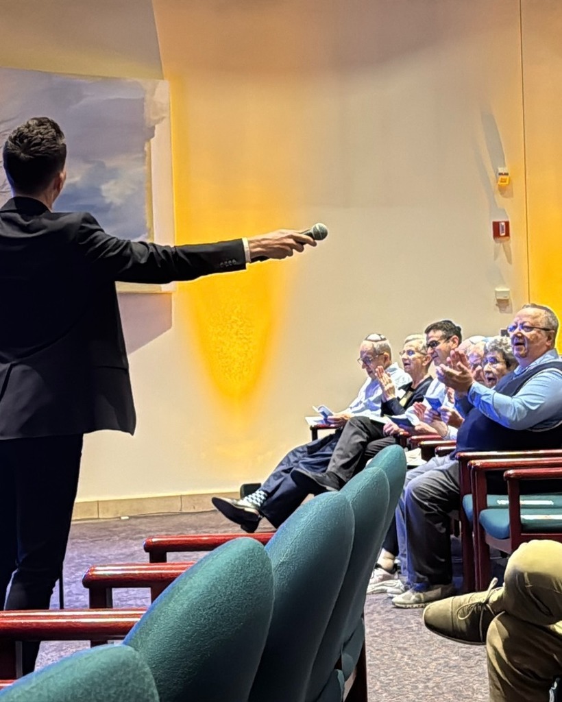 audience sings, claps along