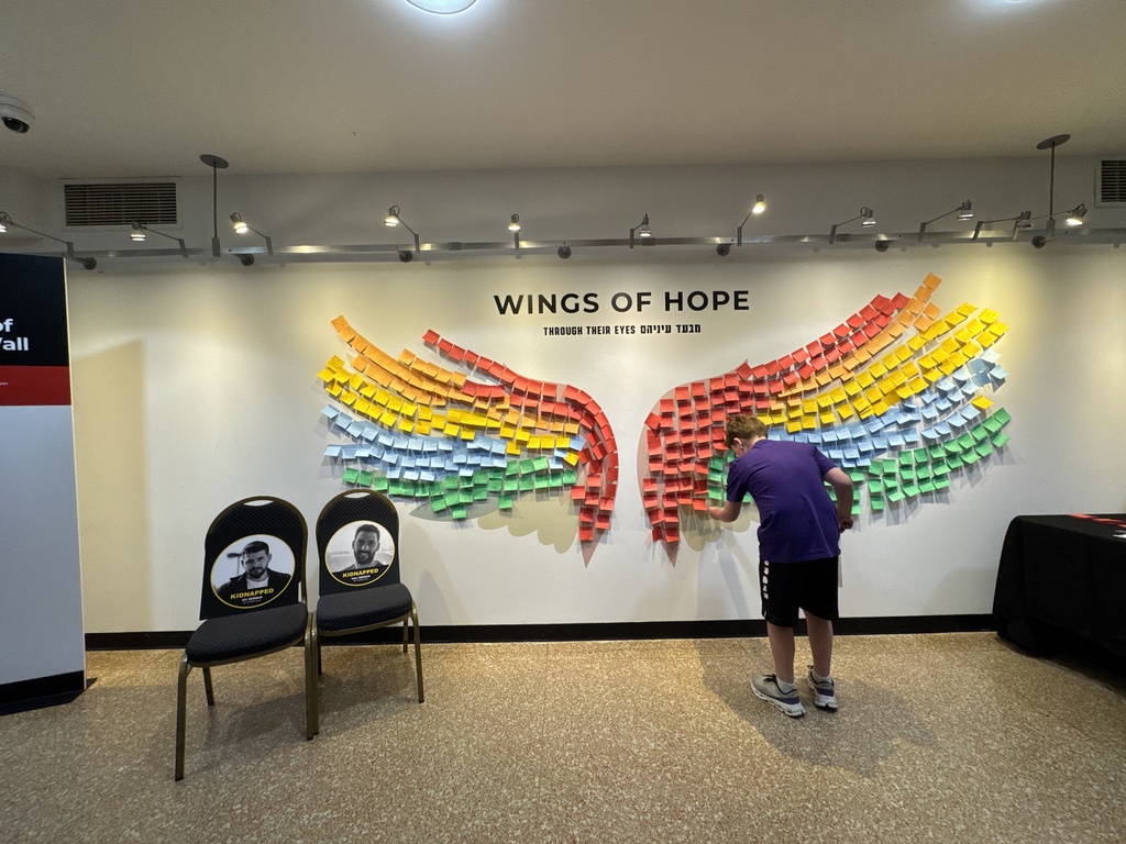 student places message on Wings of Hope