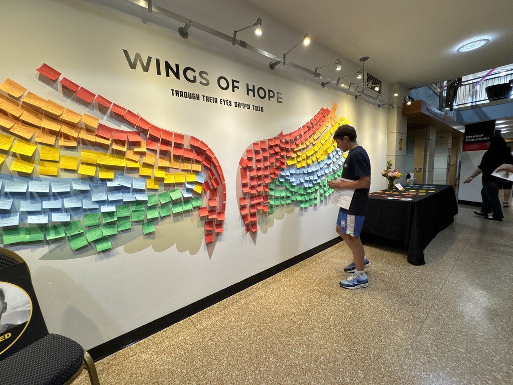 student places message on Wings of Hope