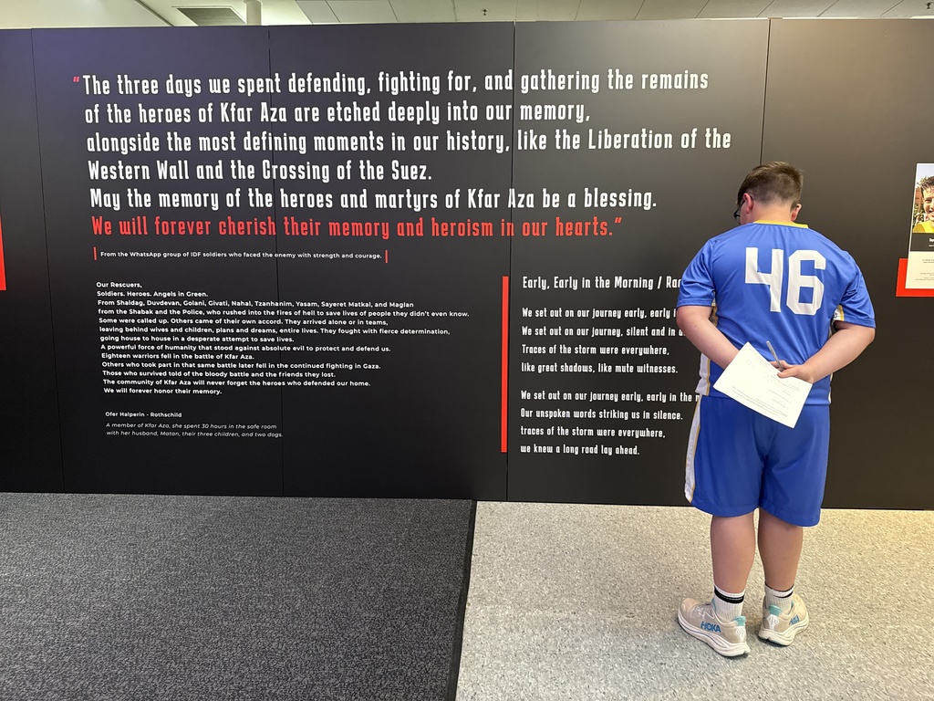 student reads poem in exhibit