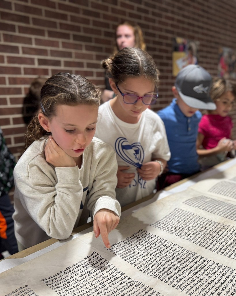 students look at Torah