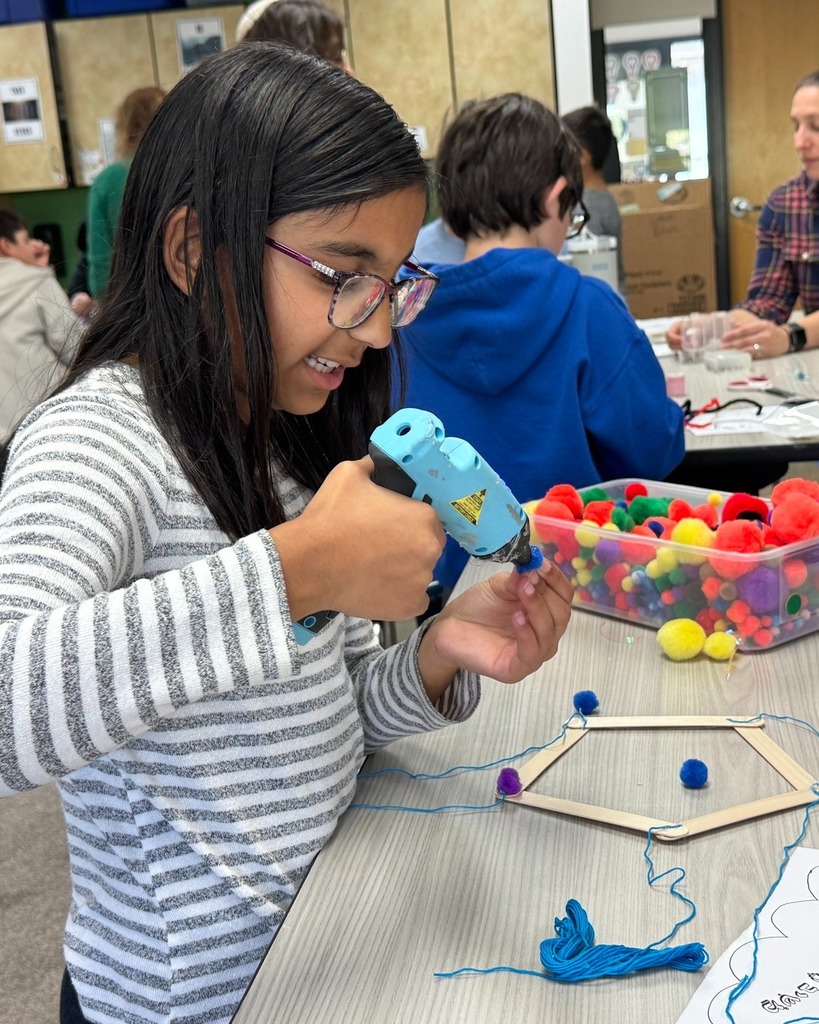 student makes rain mobile