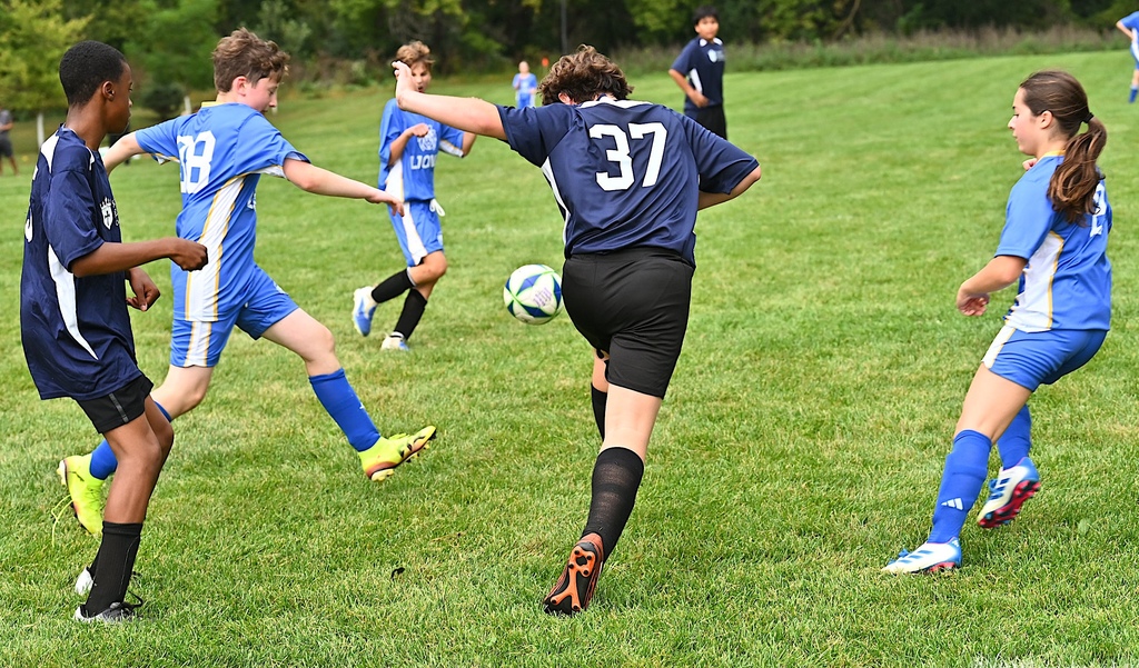 SJA and St. Helena soccer players run after ball