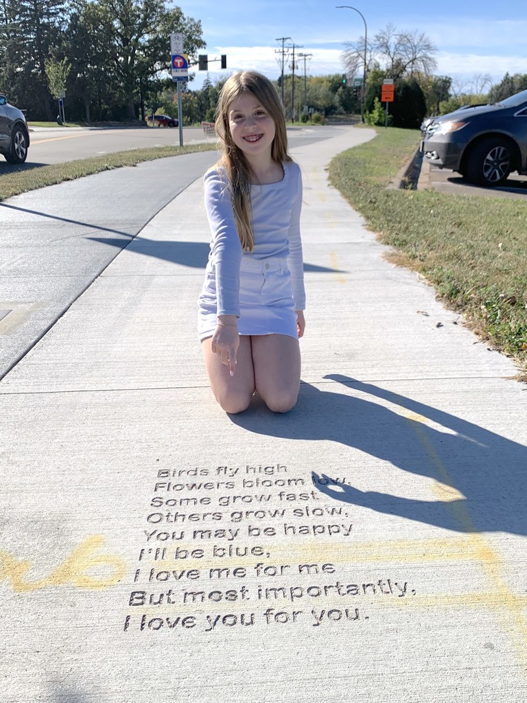 Sylvia and her poem etched into the sidewalk
