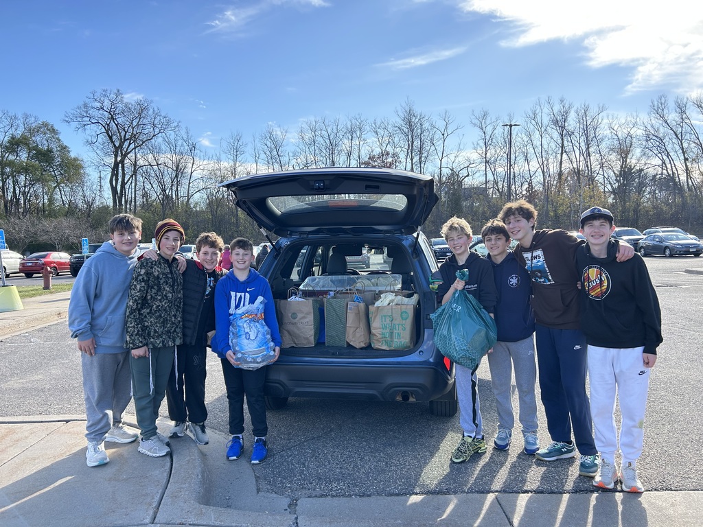 middle schoolers loaded food drive donations