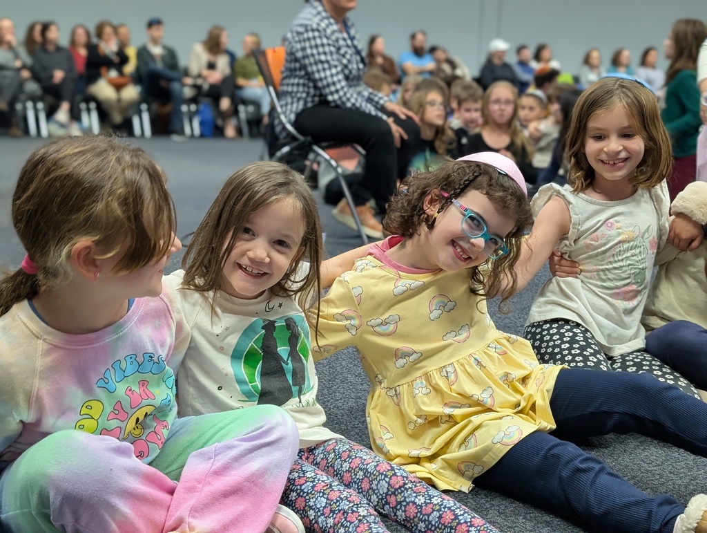 kids smiling with arms around each other at Kabbalat Shabbat