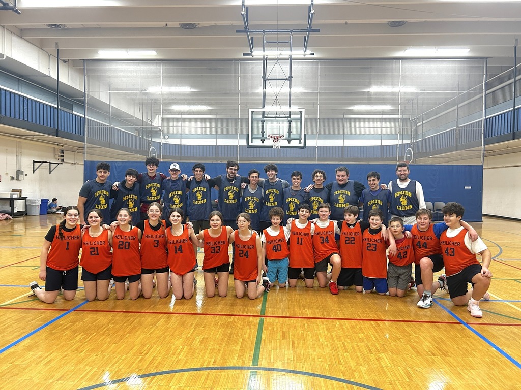 students and alumni at annual basketball game against each other
