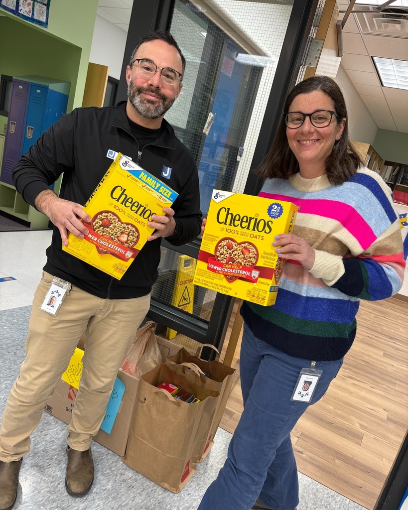 JCC staff members bring cereal boxes to food drive