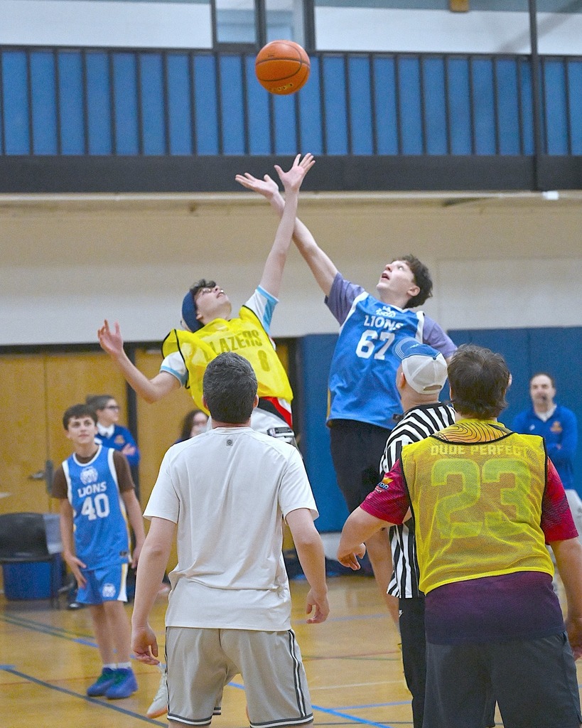 student and alum reach for jump ball