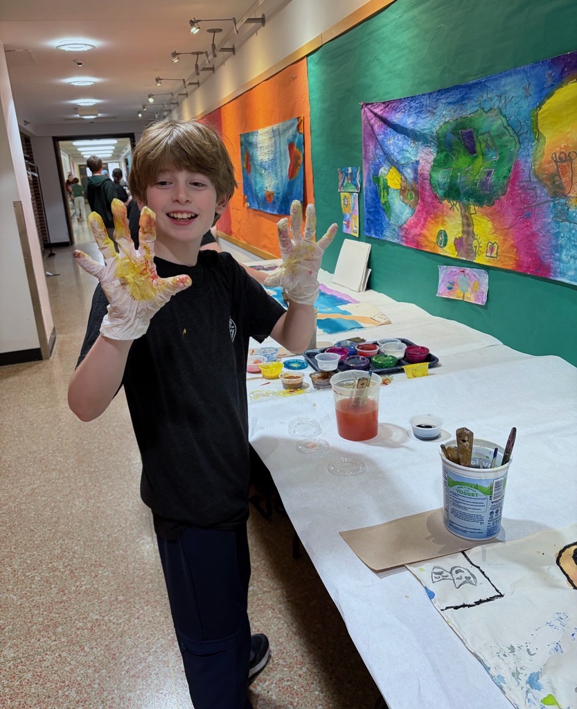 student shows dyed gloves