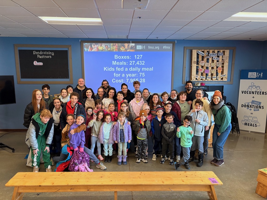 SJA families at Feed My Starving Children