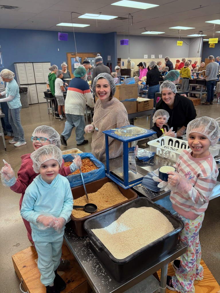 SJA families pack meals at Feed My Starving Children