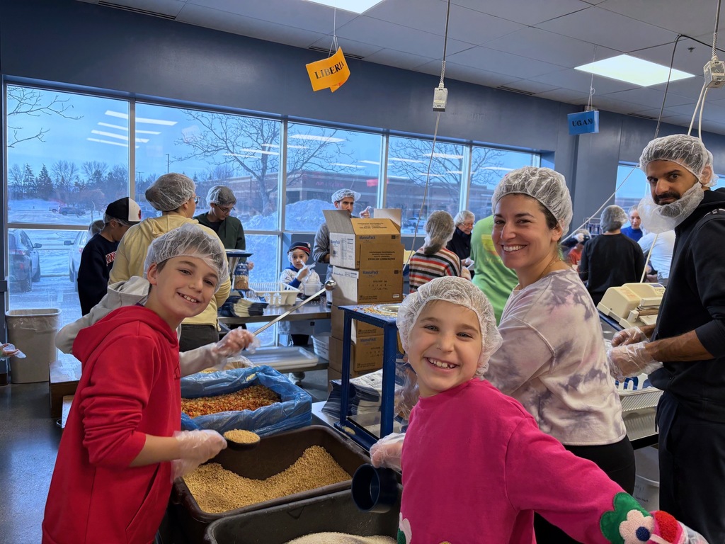 SJA families pack meals at Feed My Starving Children