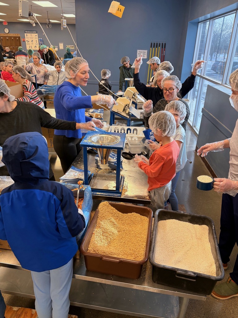 SJA families pack meals at Feed My Starving Children