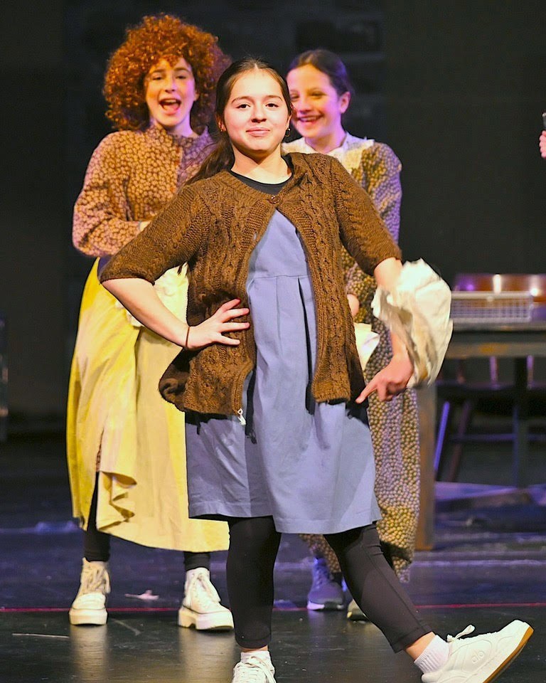 Molly pretends to be Miss Hannigan in "It's the Hard-Knock Life"
