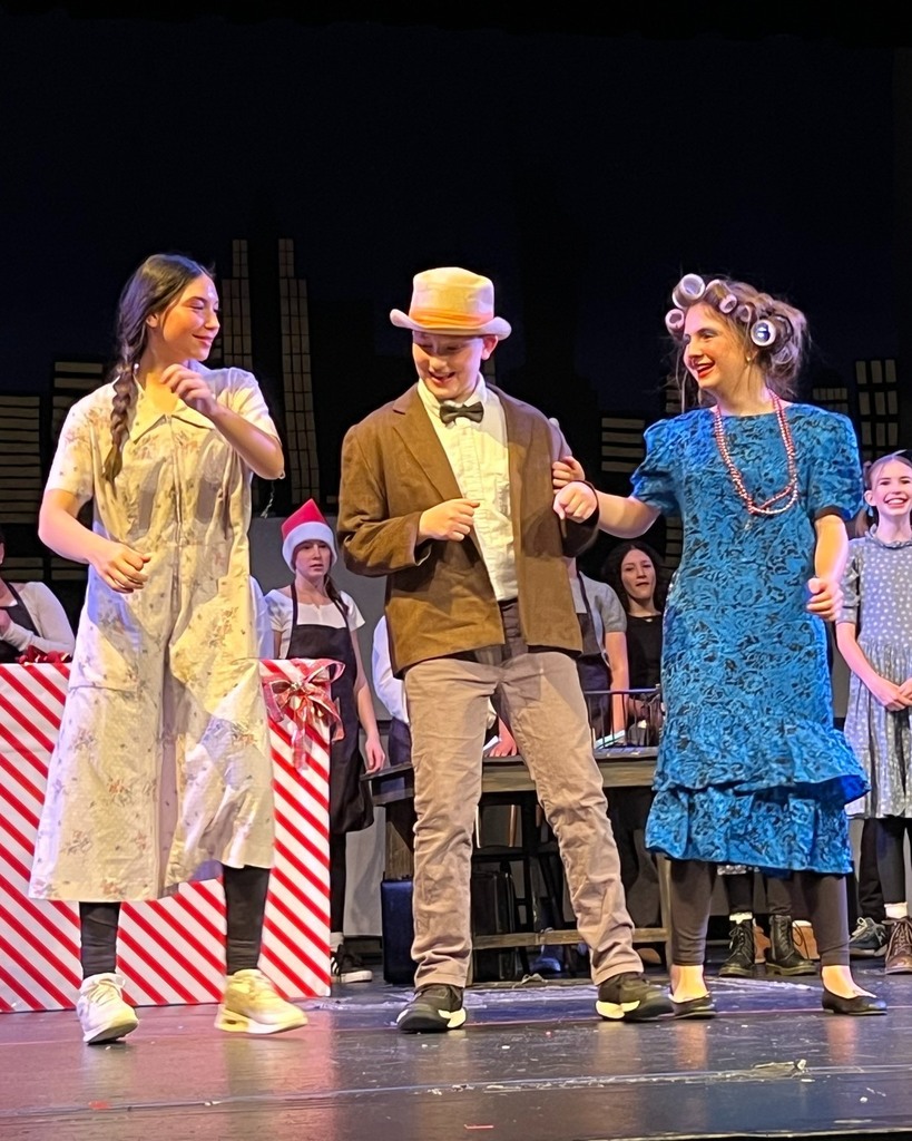 Miss Hannigan, Rooster, and Lily sing and dance "Easy Street"