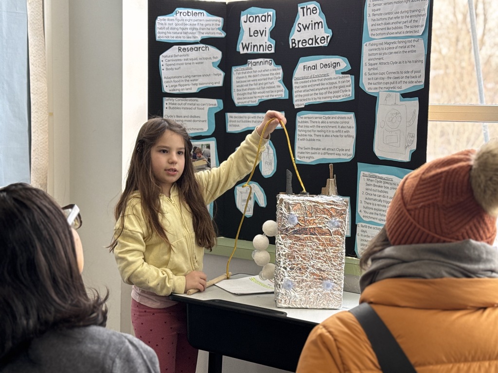 student presents sea lion enrichment design