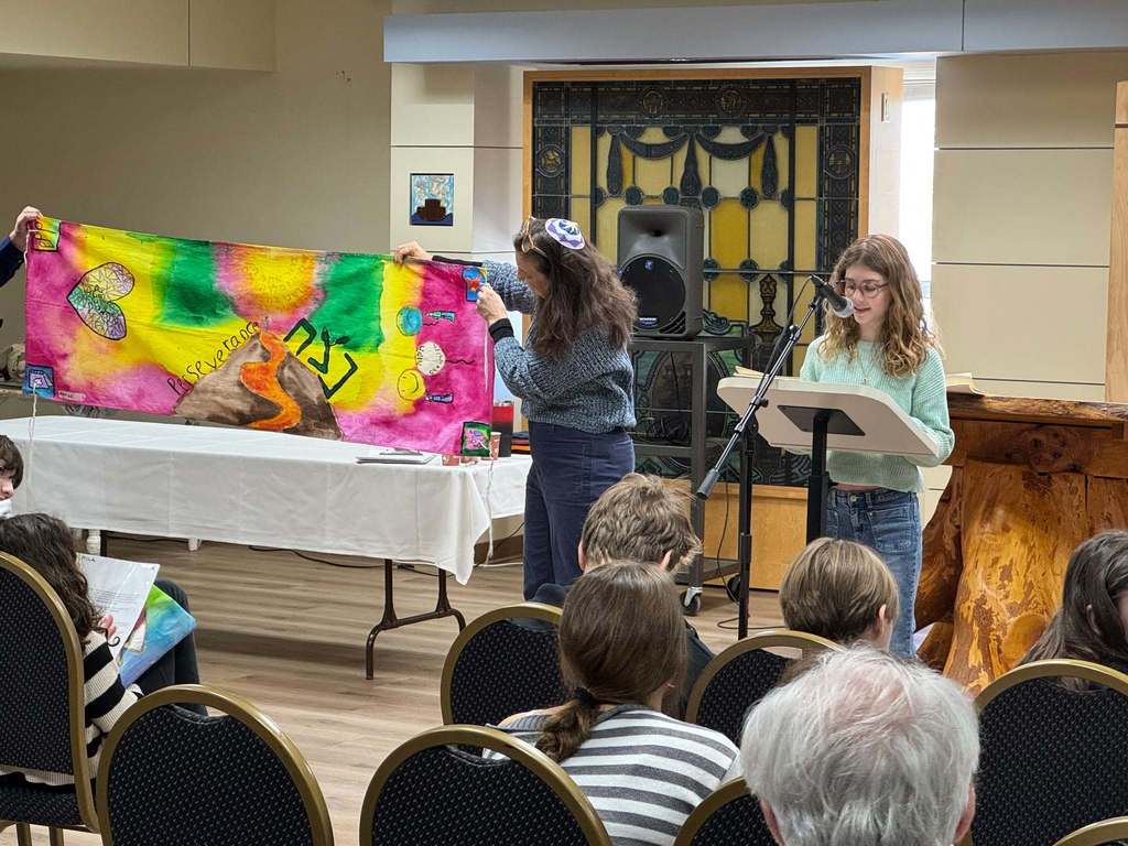 student presents her talit