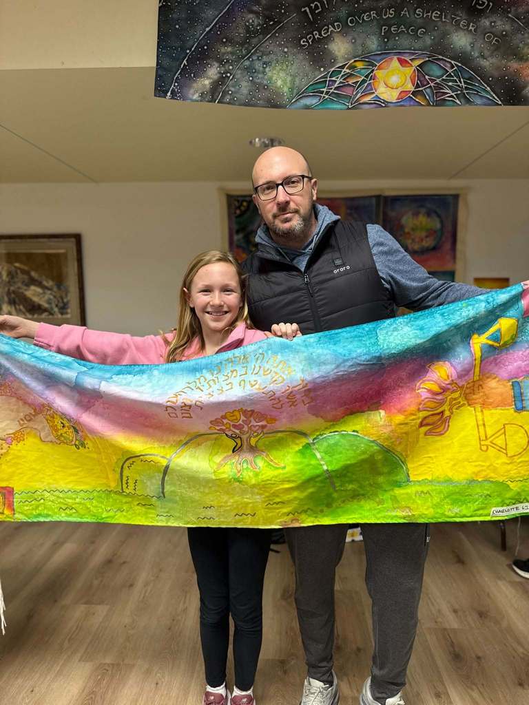 student and father show student's talit